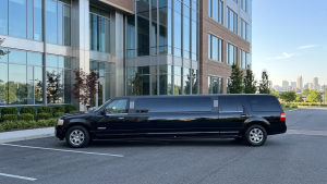 Black stretch limousine parked outside a downtown office tower